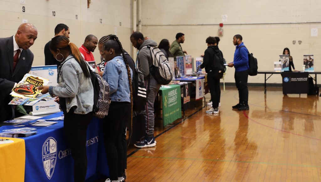 After participating in the district-wide PSAT/ SAT day in the morning, scholars attended a College Fair held in the gym.